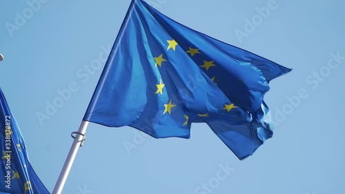 Brussels, Belgium - 04/11/2019 European Union flags wave in the wind in front of the European Commission. European cartier. Full HD, 1080p 100fps