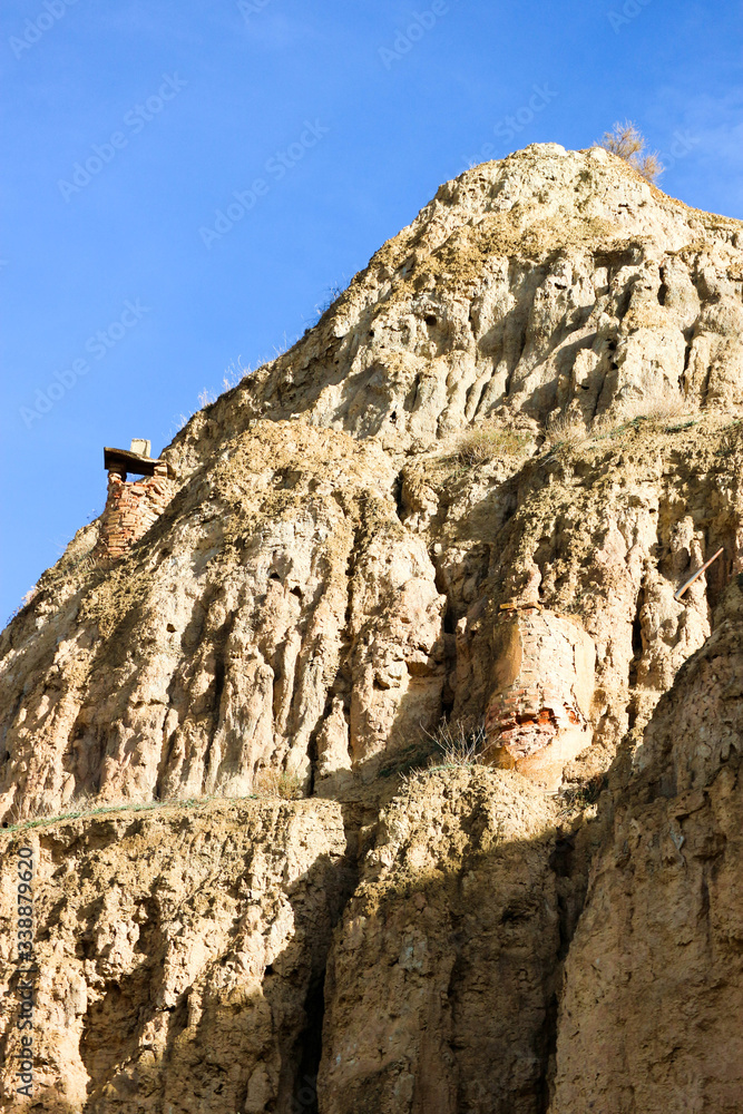 Tuff rocks of Guadix, Spain under blue sky