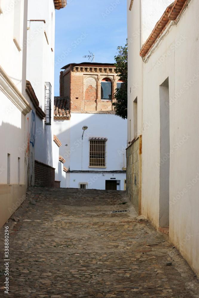 narrow cosy street in the old medieval town of Guadix, Spain