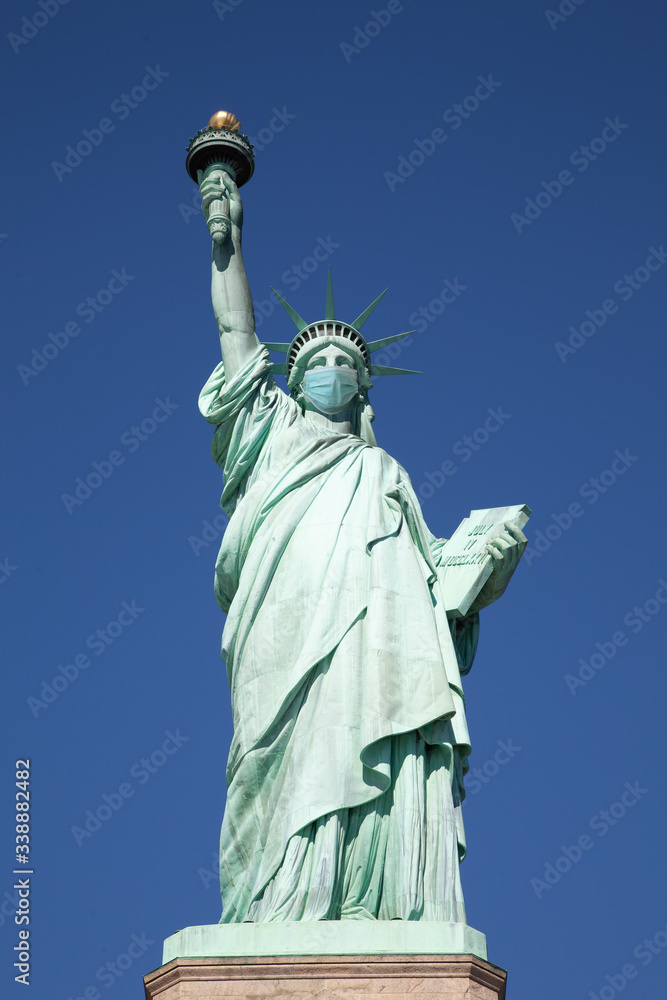 Statue of liberty wearing a surgical mask