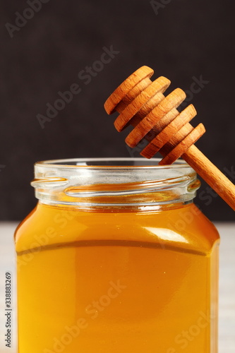 Jar of Honey with Honey Dipper photo