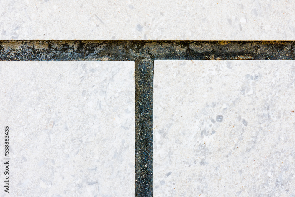 Fototapeta premium Grout between concrete floor tiles.
