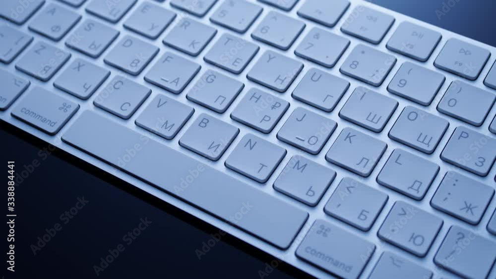 White bluetooth keyboard on a black background, modern it technology White bluetooth keyboard on a black background, modern it technology