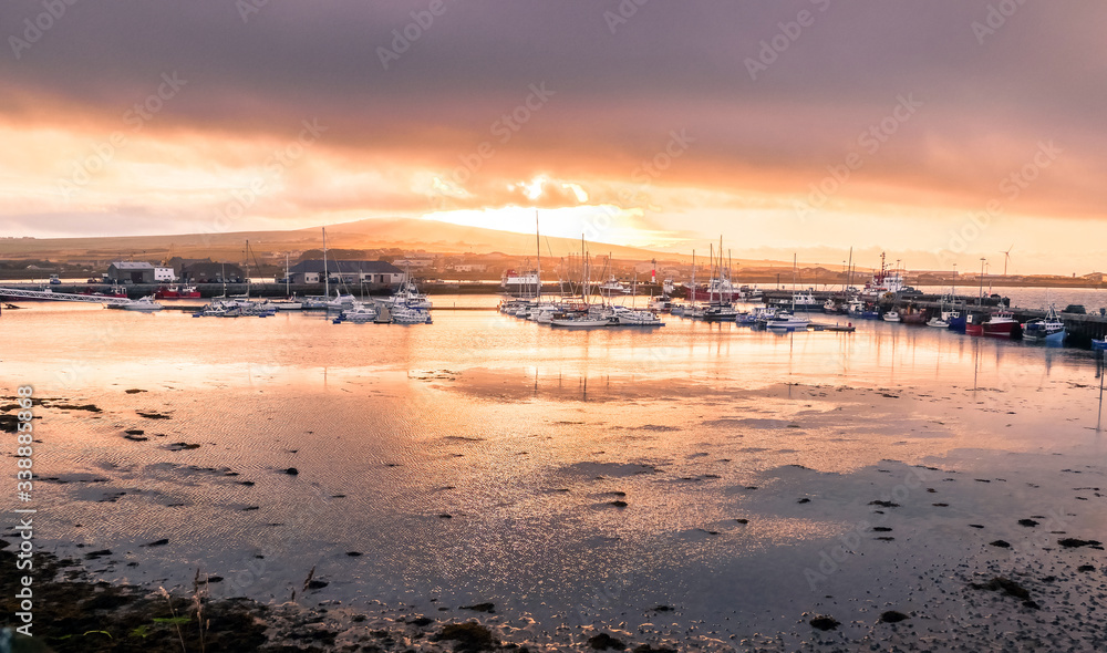 Kirkwall, Orkney, Scotland / United Kingdom - August 31, 2014: Sunset over the harbor
