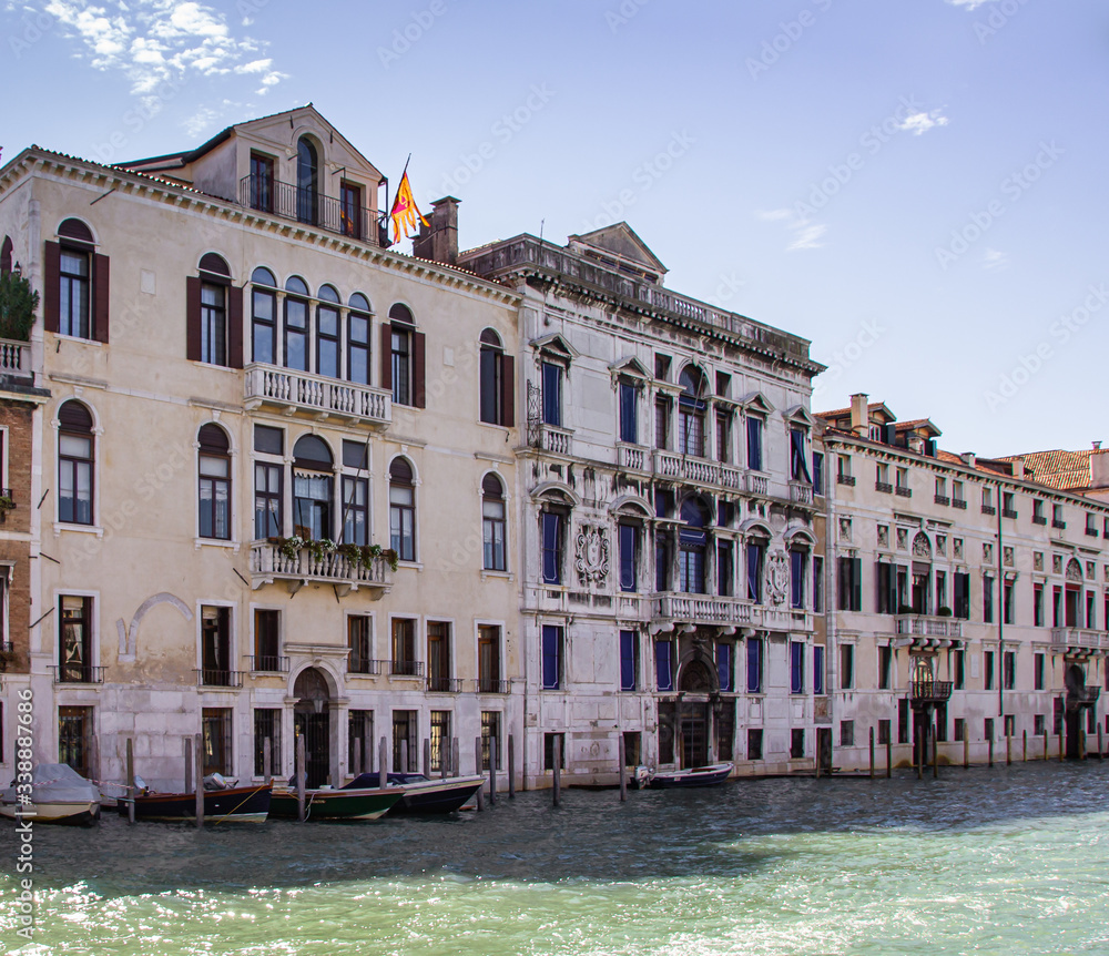 Water channels of Venice city. Facades of residential buildings overlooking the Grand Canal in Venice, Italy.