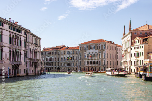 Water channels of Venice city. Facades of residential buildings overlooking the Grand Canal in Venice, Italy. © svarshik