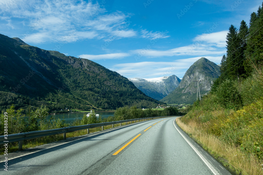 Fototapeta premium Norwegian mountain road with Josteldalsbreen glacier in the background