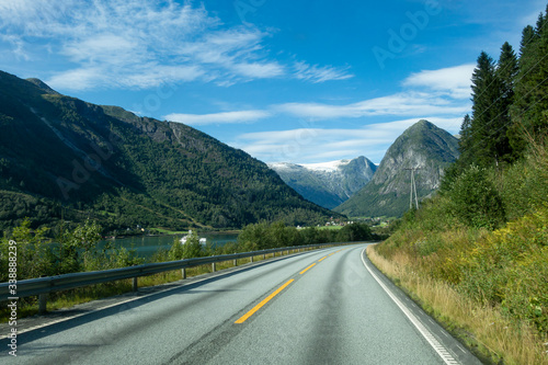 Norwegian mountain road with Josteldalsbreen glacier in the background © jcg_oida