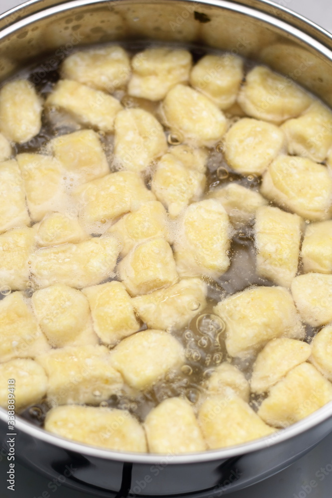 Gnocchi being prepared. Boiling. Dough dumplings with cheese. Gnocchi being prepared. Boiling. Dough dumplings with cheese.