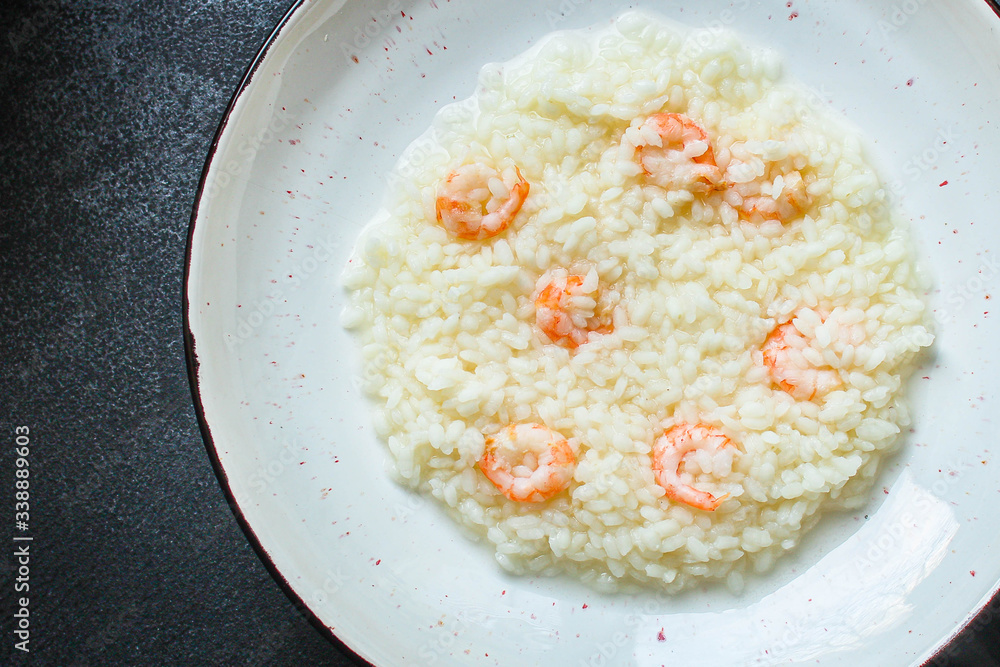 risotto shrimp prawn seafood rice Menu concept. food background. top view copy space for text keto or paleo diets risotto shrimp prawn seafood rice Menu concept. food background. top view copy space for text keto or paleo diets