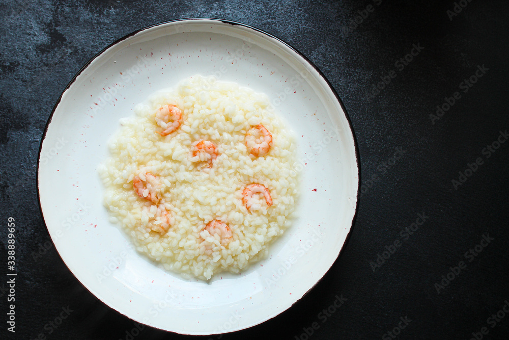 risotto shrimp prawn seafood rice Menu concept. food background. top view copy space for text keto or paleo diets risotto shrimp prawn seafood rice Menu concept. food background. top view copy space for text keto or paleo diets