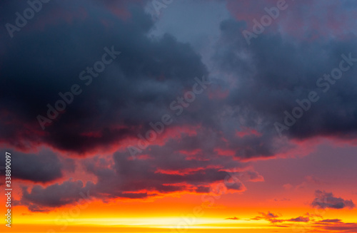 Colourful evening sky painted with red, orange, blue, grey, pink colours
