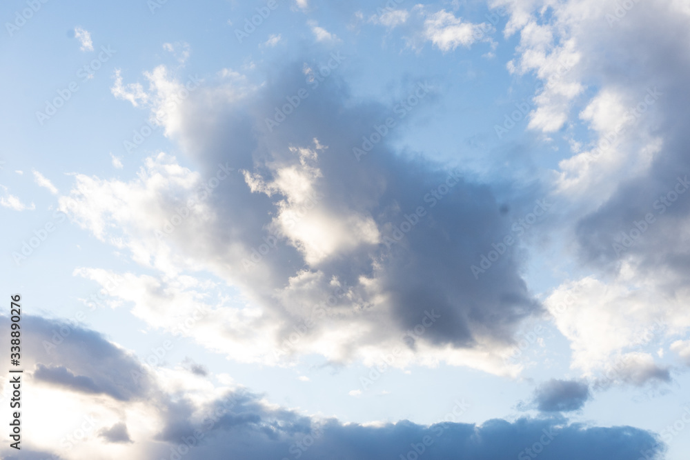 Fluffy white and storm clouds in sky Fluffy white and storm clouds in sky