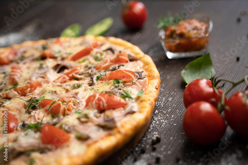 Italian cuisine. Pizza with various toppings.