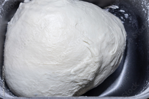 Obraz na plátně Bread dough in breadmaker machine dispenser