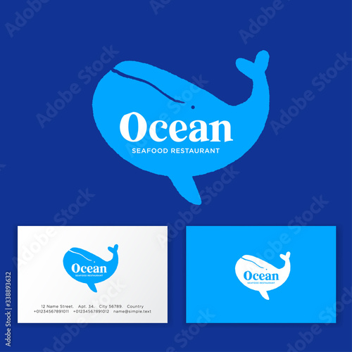 Seafood restaurant logo. Silhouette of Blue Whale with letters. Business card.