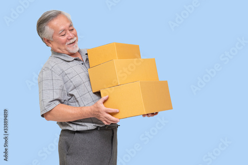 Happy asian senior man holding package parcel box, Delivery courier and sell product with online shipping service concept