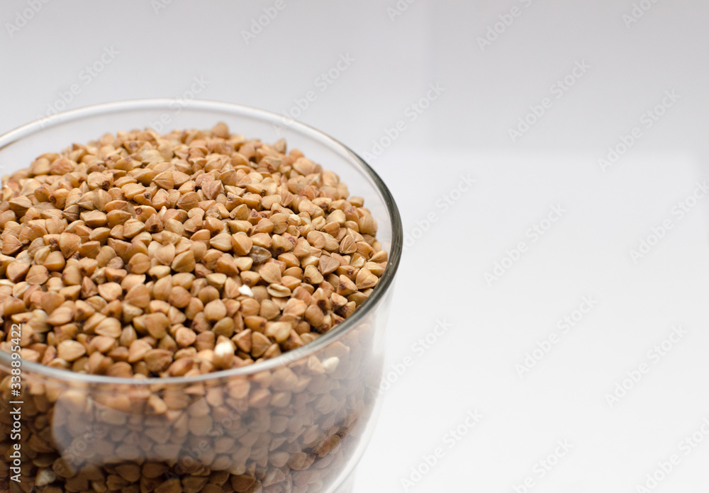 buckwheat groats on a light background, closeup texture