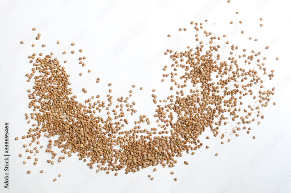 buckwheat groats on a light background, closeup texture buckwheat groats on a light background, closeup texture