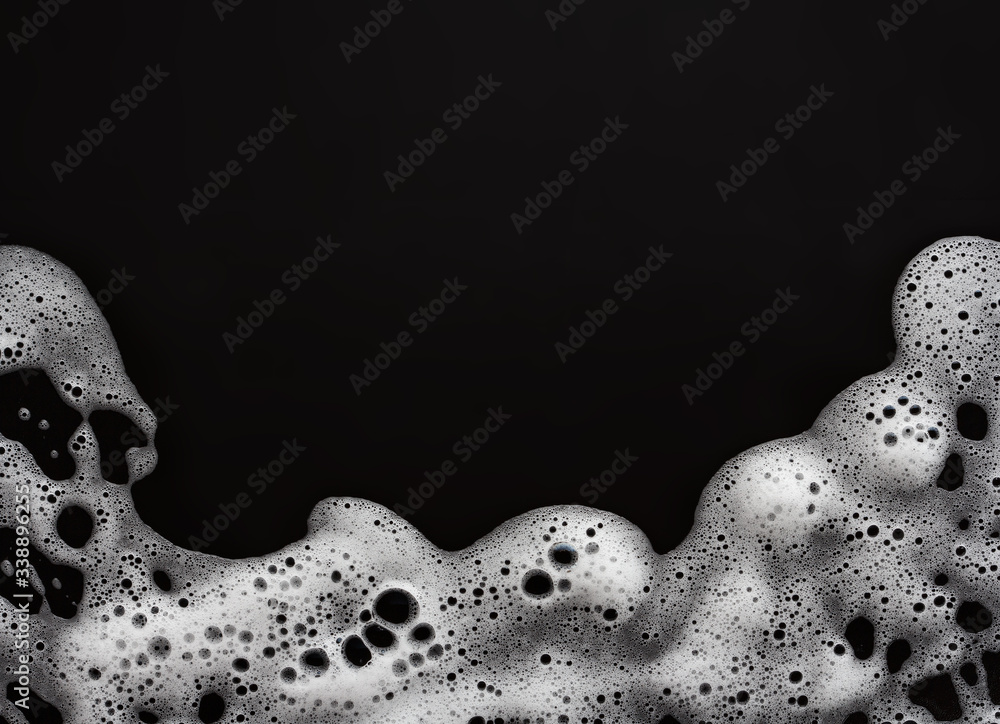 soap foam on black background, with copy space