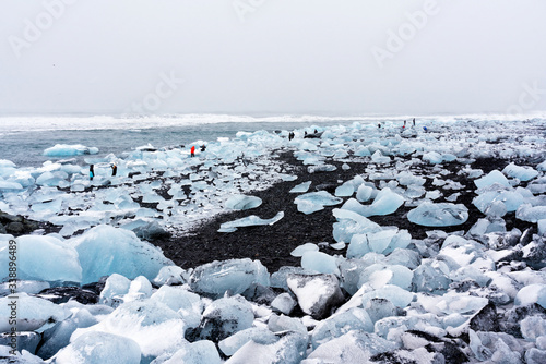 Ice rock with black sand beach at Jokulsarlon beach (Diamond beach) in southeast Iceland
 photo