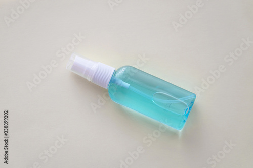 Hand sanitizer blue bottle on white background, anti-infective hygienic antibacterial agent concept