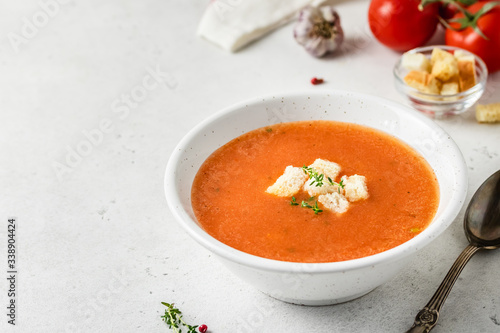 Roasted tomato red pepper soup. Selective focus, copy spce.