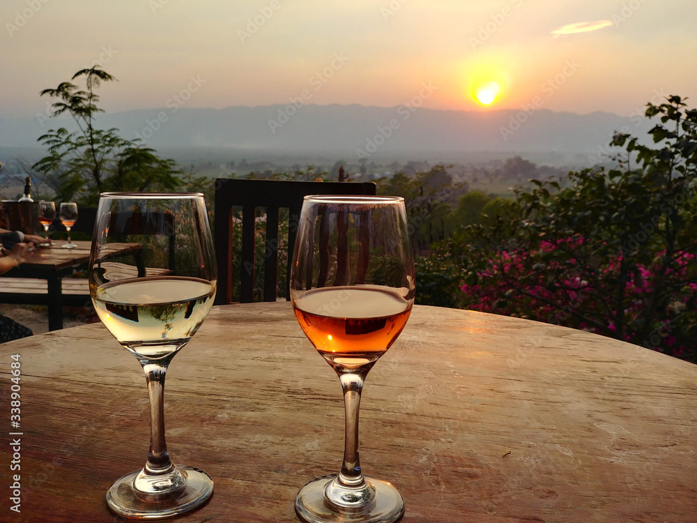 Sunset with two local glasses of wine at the Red Mountain Winery in Myanmar, just above the Inle lake