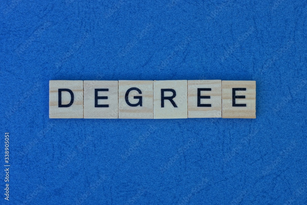 Obraz premium inscription from a short word degree from gray square wooden letters on a dark blue table
