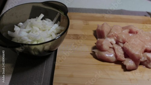 raw chicken meat on a cutting board, cooking at home