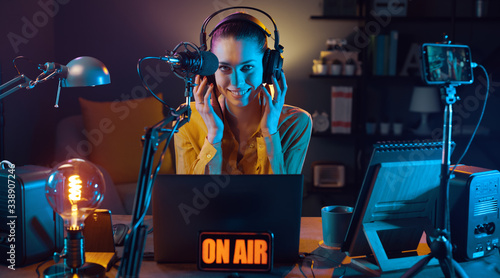 Young radio host broadcasting at the radio station