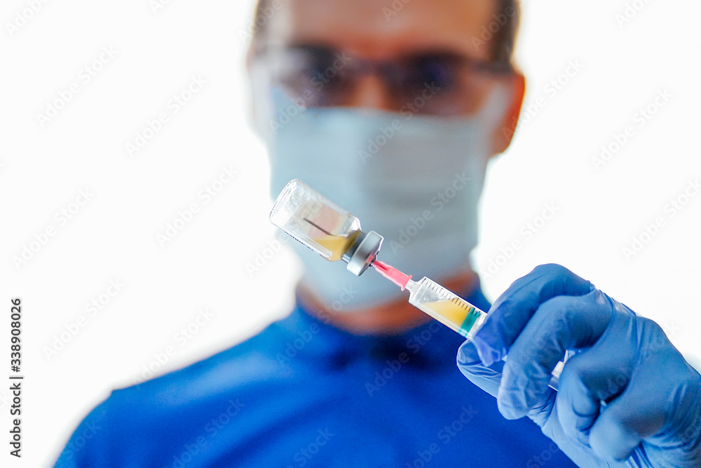 Doctor with face mask, using smartphone Doctor with face mask, using smartphone