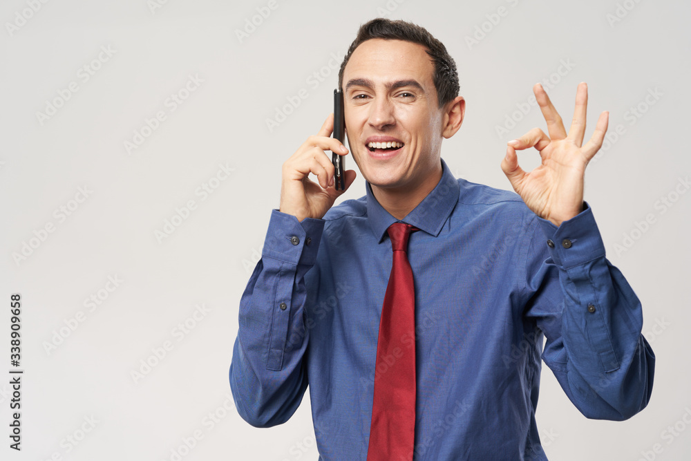 young businessman talking on the phone young businessman talking on the phone