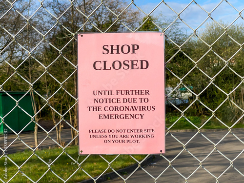 "Shop closed" notice due to the coronavirus emergenchy health pandemic on the fence of an allotment