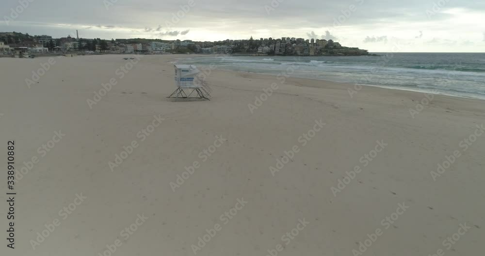 Aerial Shot of lifeguard tower on deserted Bondi Beach, closed due to COVID-19 Aerial Shot of lifeguard tower on deserted Bondi Beach, closed due to COVID-19