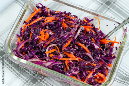 Vegetarian salad with shredded red cabbage and carrot.