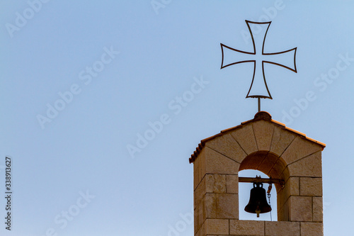 Cross and bell on top of the church at Tabgha, Israel, where Jesus is supposed to have multiplied bread anf fishes