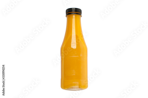 Plastic bottle of yellow orange fruit juice