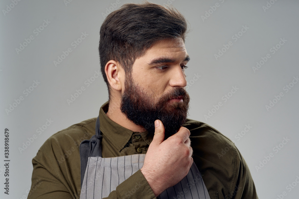 Bearded man apron professional hairdresser hair care Bearded man apron professional hairdresser hair care