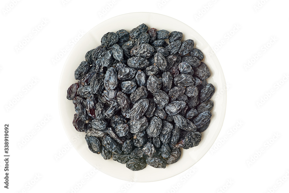 Bowl of black raisins on white Bowl of black raisins on white