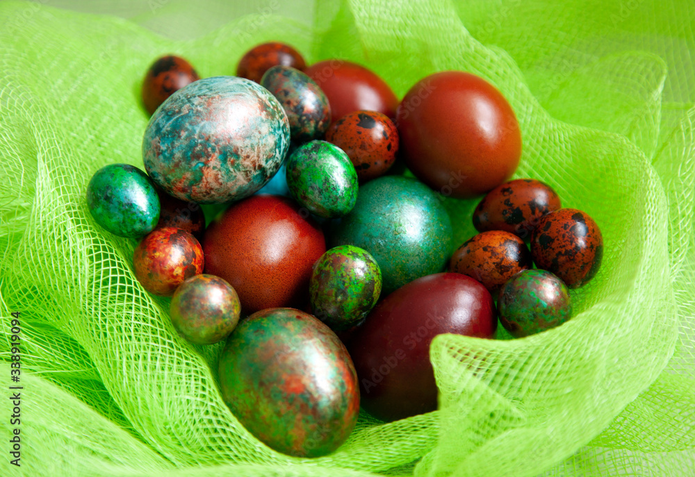 multicolored easter eggs in a basket multicolored easter eggs in a basket