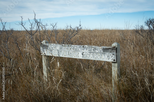 Εκτύπωση καμβά Old weathered wood sign area reserved for nature programs in austere winter la