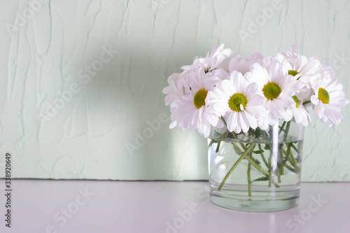 Wallpaper Mural chrysanthemums in a transparent vase on a table Torontodigital.ca