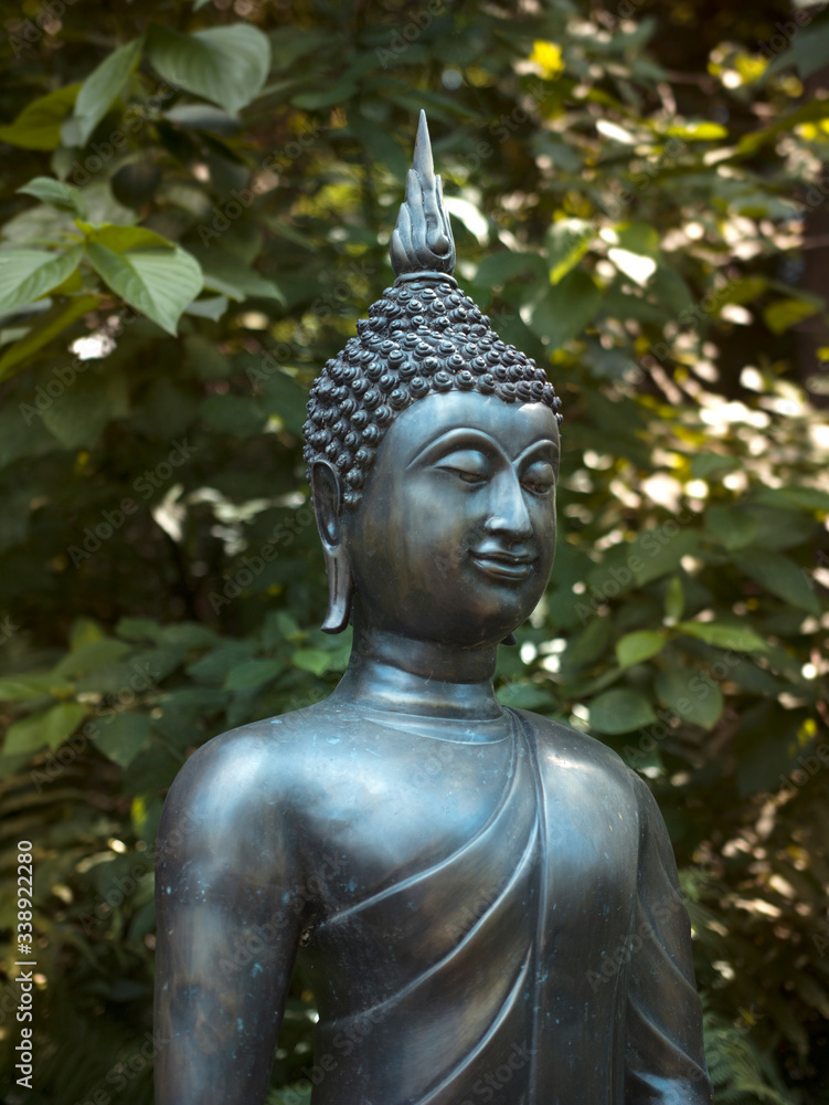 Zlin, Czech republic, February 17, 2020: buddha, statue, meditation, relaxation, statue standing in the garden