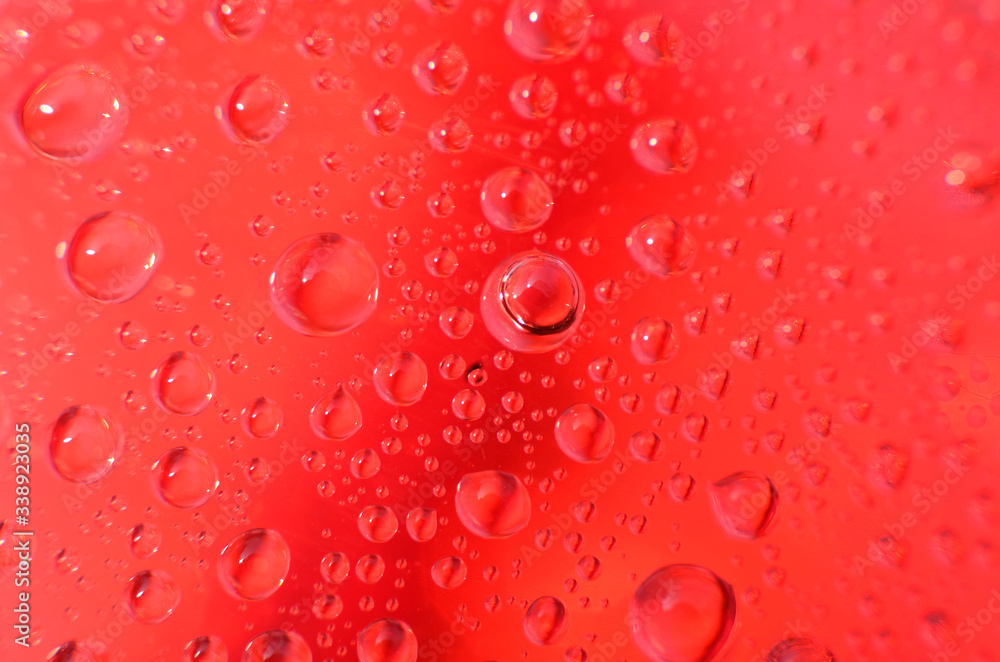 shiny clear water point attached to a glass reflects the same color as the color on the glass into a beautiful background as decoration shiny clear water point attached to a glass reflects the same color as the color on the glass into a beautiful background as decoration