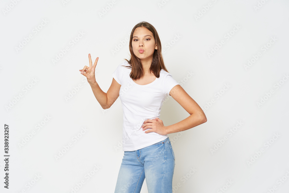 Cheerful beautiful girl lifestyle emotions design studio gray background Cheerful beautiful girl lifestyle emotions design studio gray background
