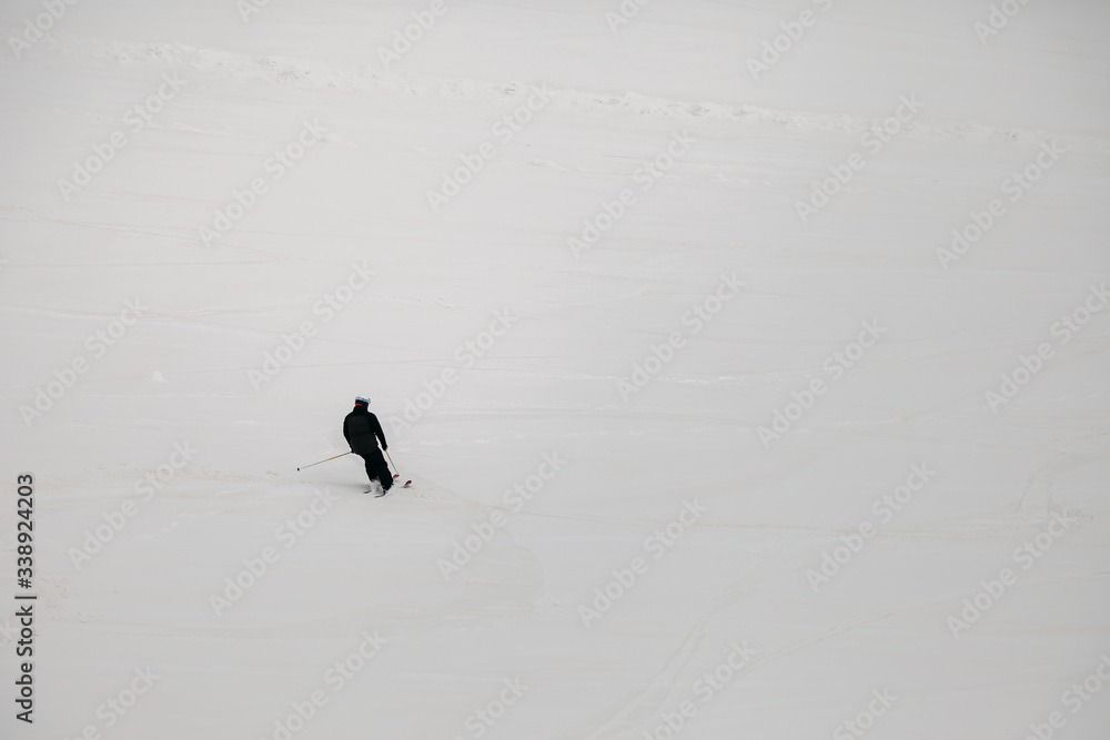 skier coming down from the mountains skier coming down from the mountains