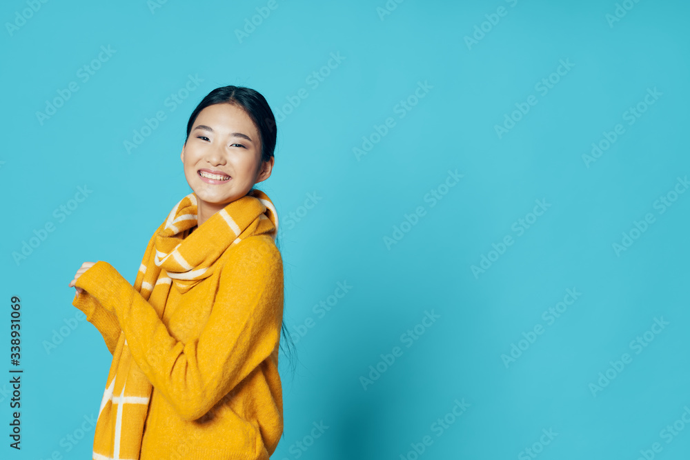 Cheerful woman of Asian appearance blue background charm model Cheerful woman of Asian appearance blue background charm model