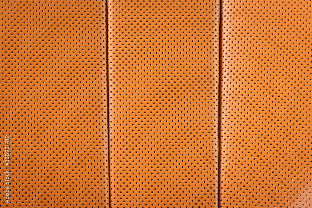 Obraz premium Perforated red leather background