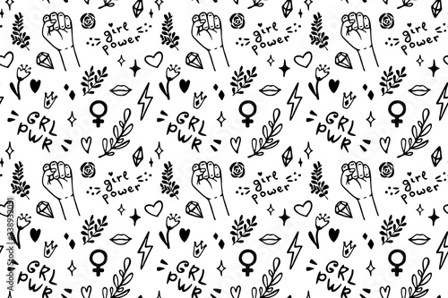 Vector seamless pattern with hand drawn elements on feminism theme: raised fist, slogans, symbol, crown, lips, hearts, branches, diamonds, sparks. photo